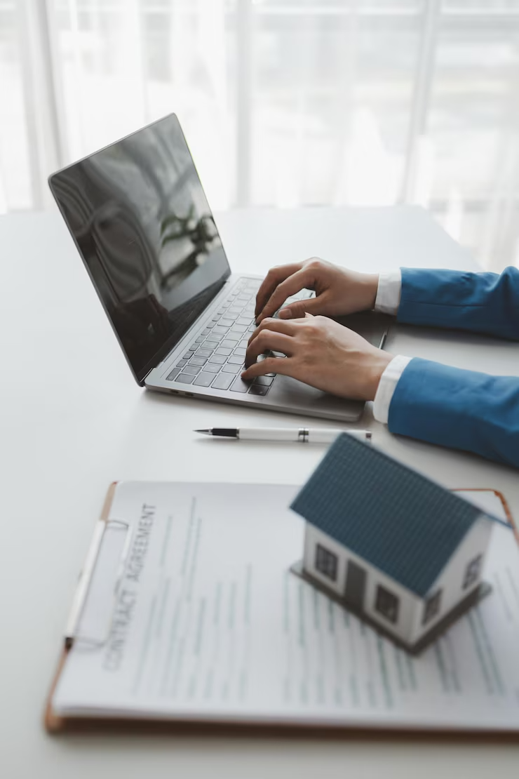 house insurance paperwork realtor is explaining home insurance documents buyer his office company si